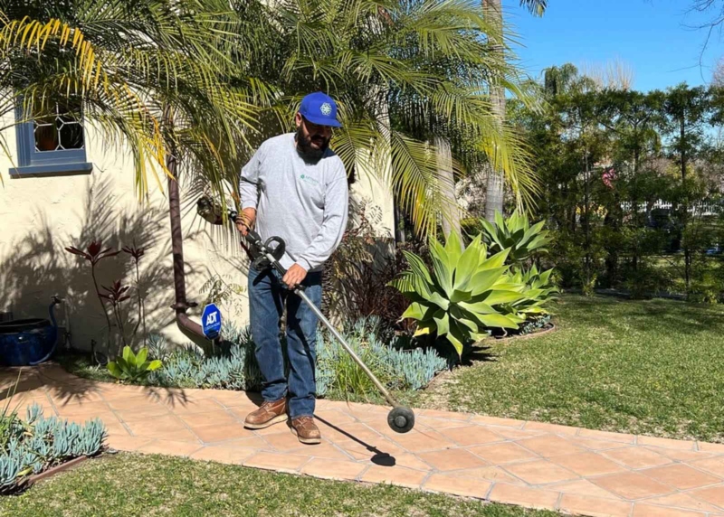 Landscaper weedwacking