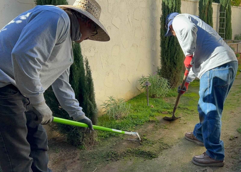 Landscapers digging in the dirt